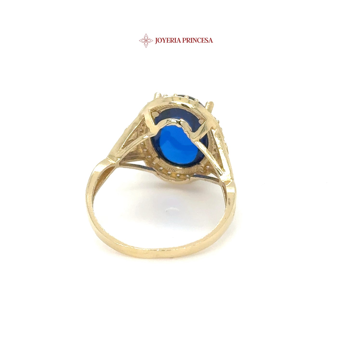 Anillo de oro de 14 quilates con cabujón azul y halo de circonitas