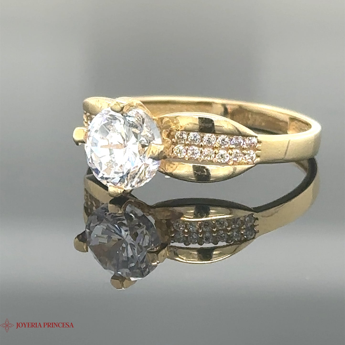 Anillo de compromiso con diseño de lazo de 14 quilates y circonita circular