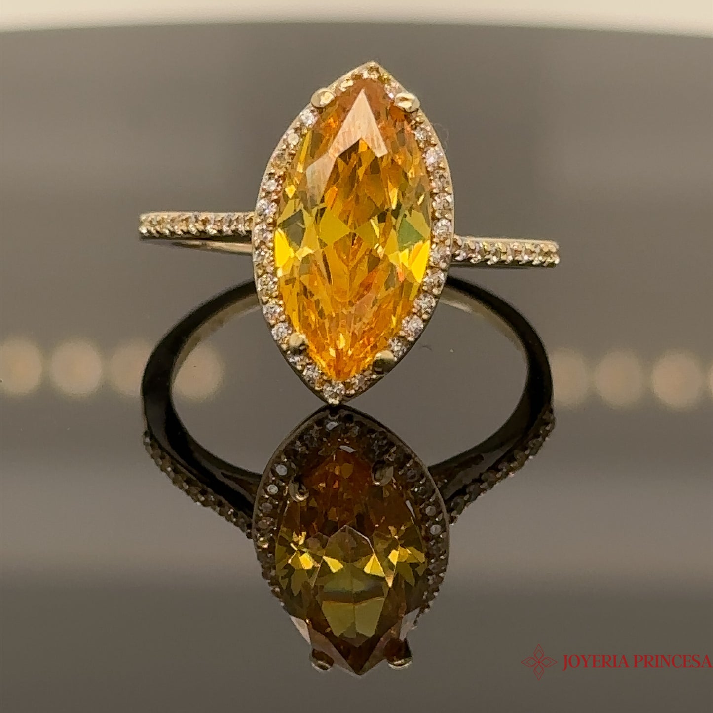 Anillo de 14 quilates con circonita marquesa-topacio